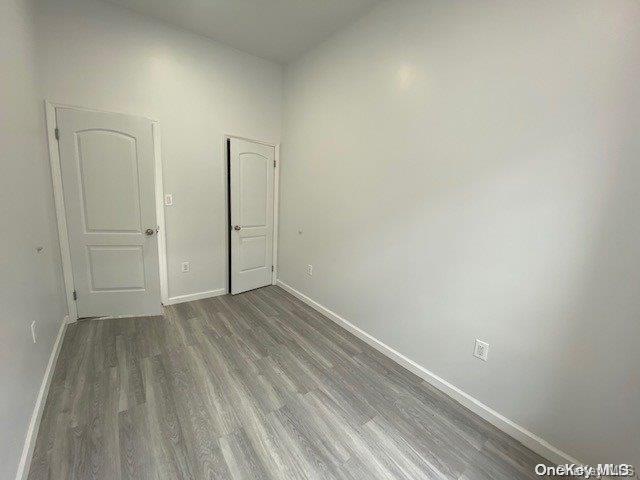 unfurnished room featuring hardwood / wood-style floors