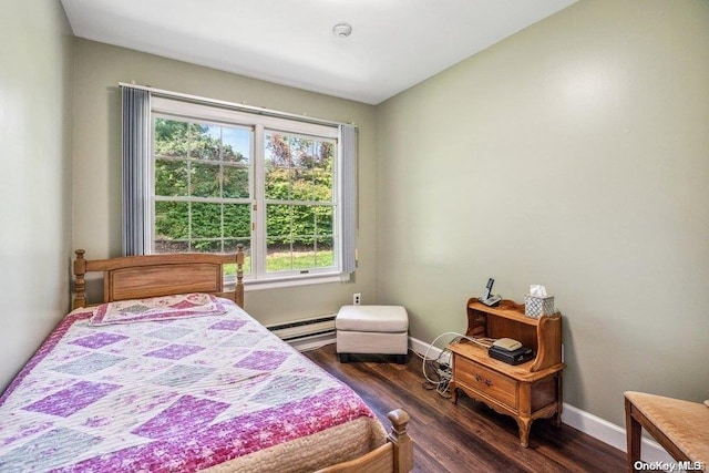 bedroom featuring a baseboard radiator and dark hardwood / wood-style floors