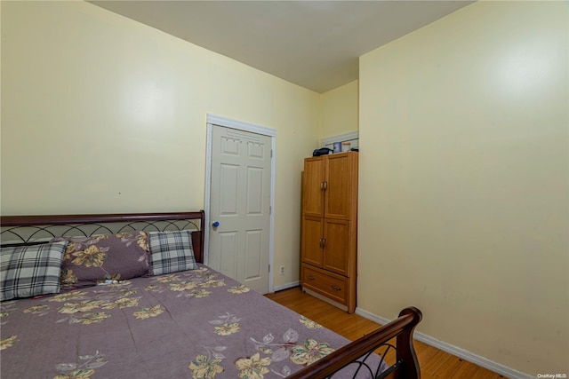 bedroom featuring a closet and light hardwood / wood-style floors