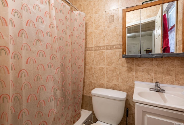 full bathroom with shower / tub combo, vanity, tile walls, and toilet