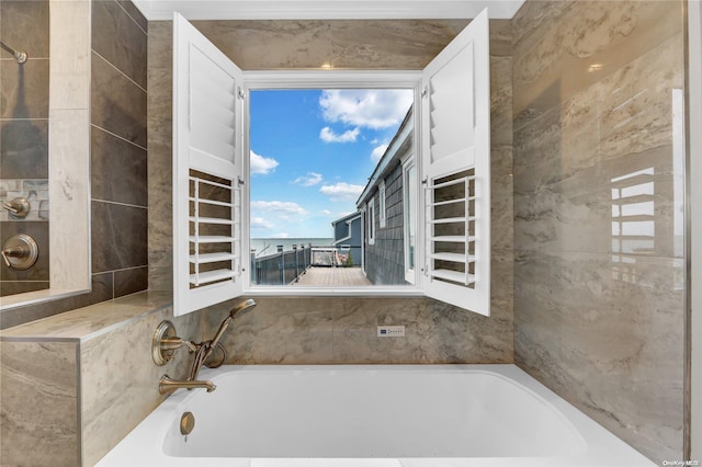 bathroom with a tub to relax in