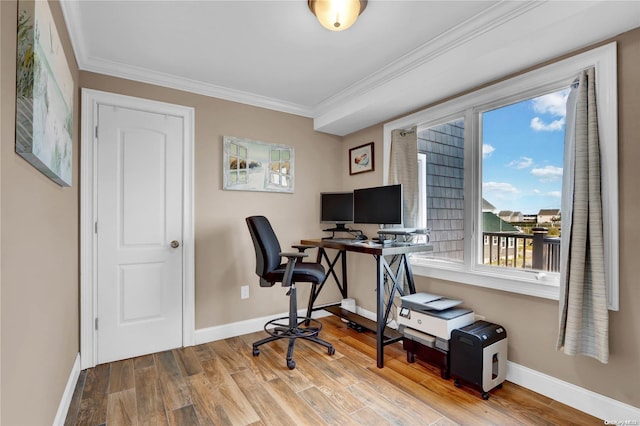 office area with wood-type flooring and ornamental molding