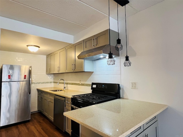 kitchen featuring decorative backsplash, sink, hanging light fixtures, appliances with stainless steel finishes, and dark hardwood / wood-style flooring