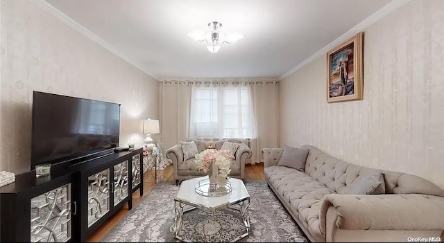 living room featuring hardwood / wood-style floors and crown molding