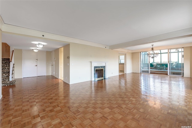 unfurnished living room with parquet floors, a high end fireplace, and a chandelier