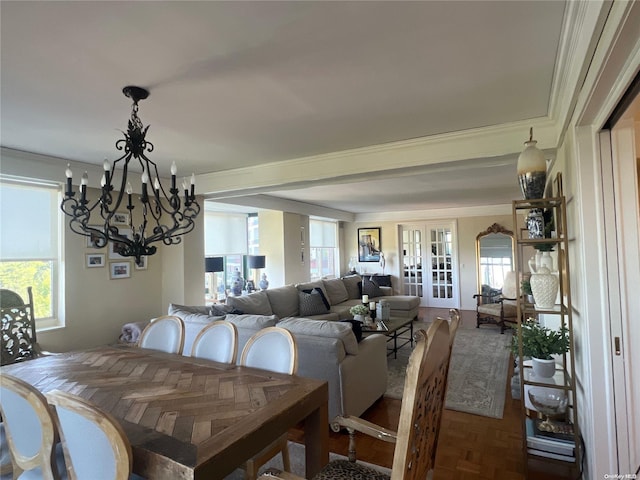 dining space featuring dark parquet flooring, crown molding, french doors, and a healthy amount of sunlight