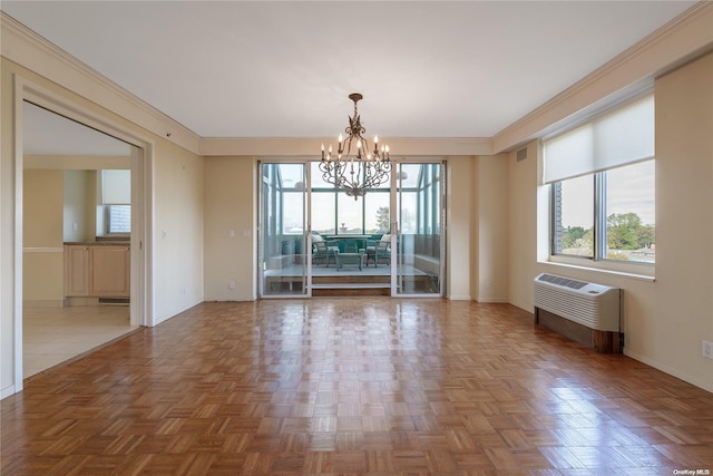 interior space featuring crown molding, parquet floors, and an inviting chandelier