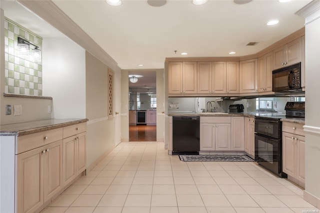 kitchen featuring light stone counters, beverage cooler, sink, black appliances, and light tile patterned floors