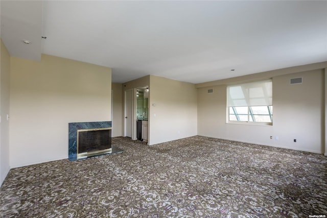 unfurnished living room with a fireplace