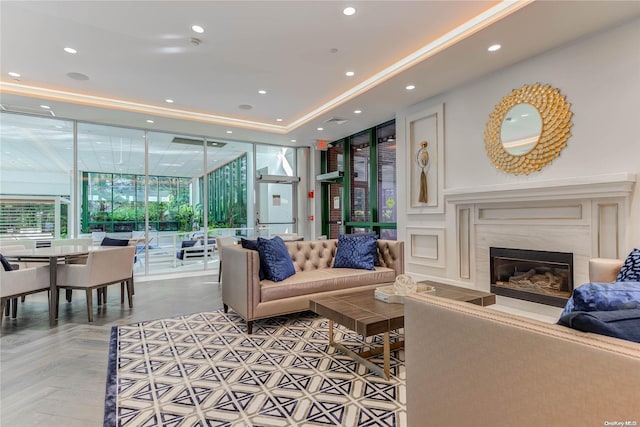 living room with floor to ceiling windows and a premium fireplace