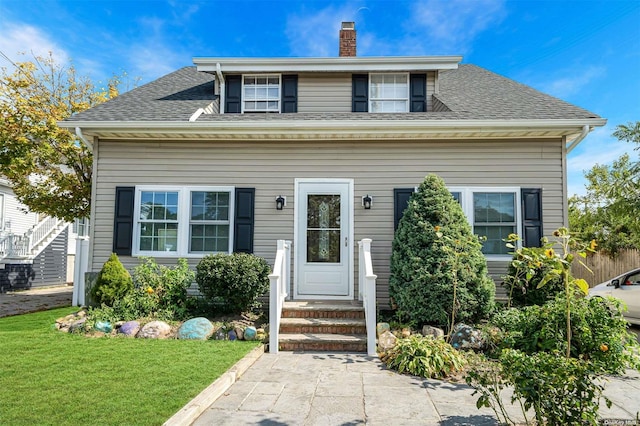 view of front of home featuring a front lawn