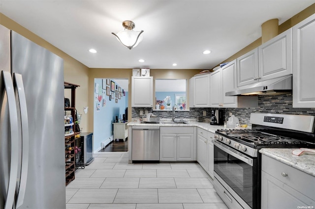 kitchen featuring sink, white cabinetry, and stainless steel appliances