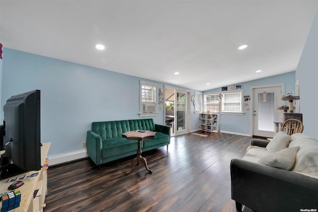 living room with dark hardwood / wood-style floors and lofted ceiling