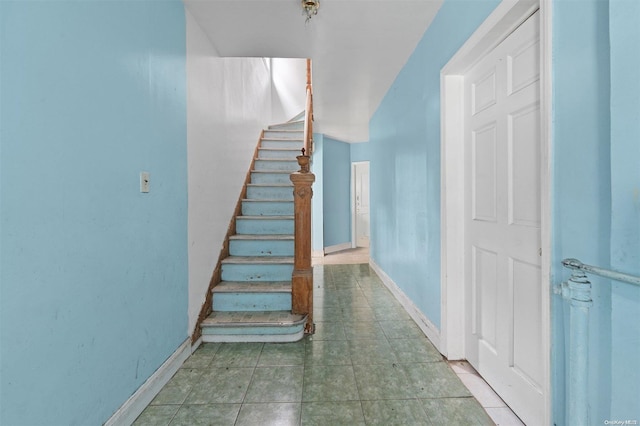 stairs with tile patterned flooring