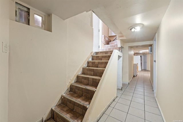 staircase featuring tile patterned floors