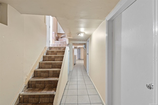 staircase with tile patterned flooring