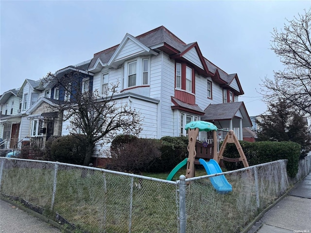 view of front of house with a playground