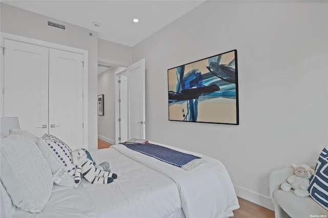 bedroom with a closet and light wood-type flooring