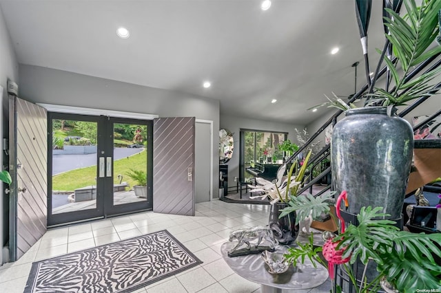 tiled entrance foyer featuring french doors