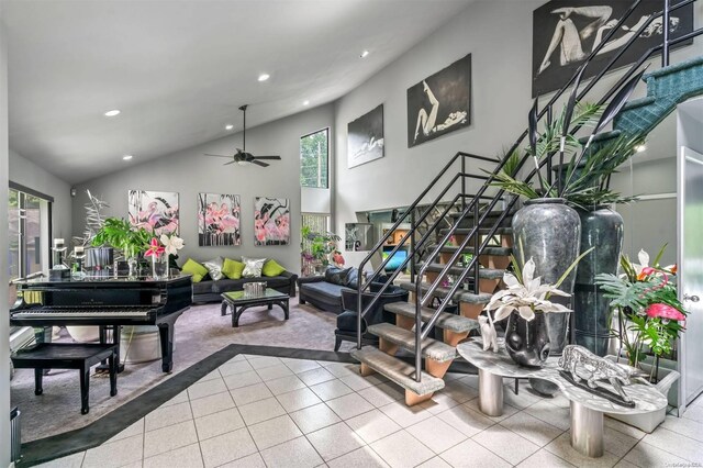 gym with ceiling fan and lofted ceiling