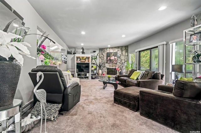 living room with a fireplace and light carpet