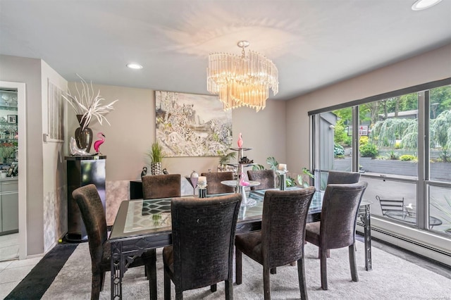 dining area with a baseboard radiator and a chandelier