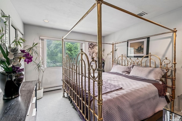 bedroom featuring carpet flooring and a baseboard radiator