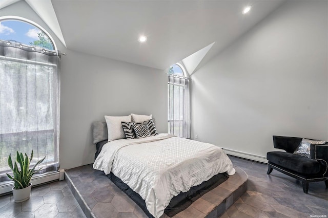 bedroom with lofted ceiling and baseboard heating