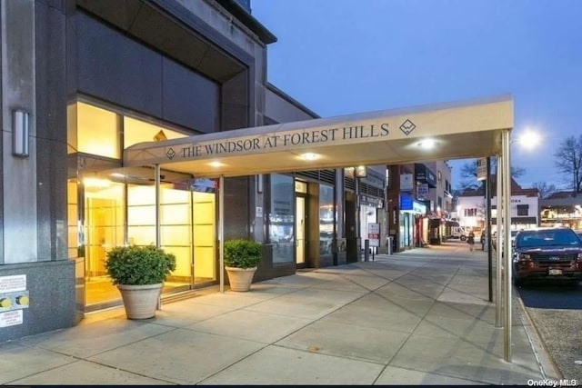 view of outdoor building at dusk