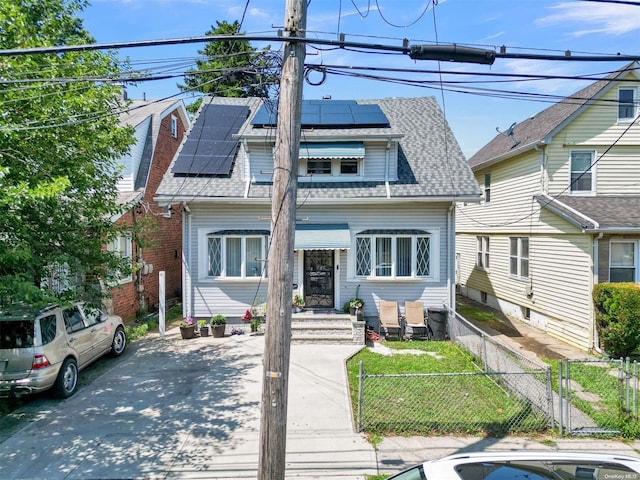 view of front of house featuring solar panels