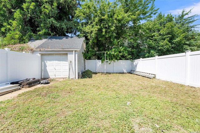 view of yard with an outbuilding and a garage