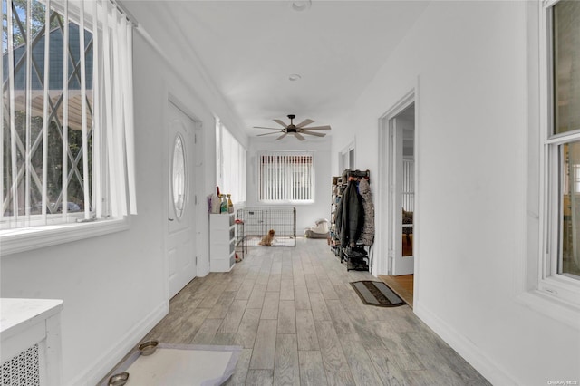 hall with light hardwood / wood-style floors