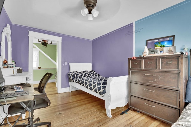 bedroom featuring ceiling fan and light wood-type flooring