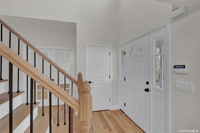 foyer entrance with light wood-type flooring