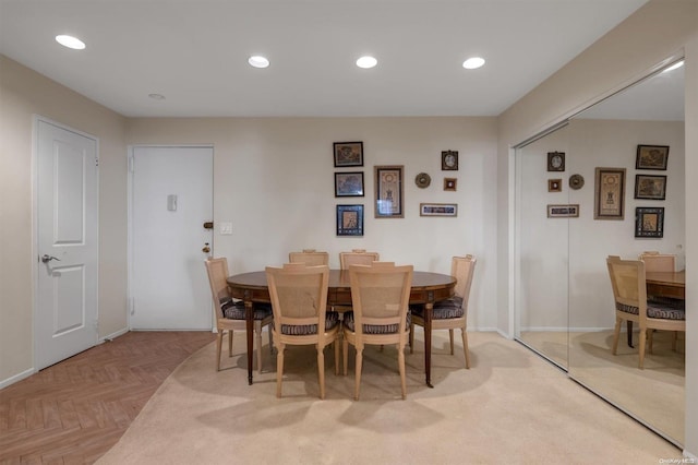 dining space with light parquet floors