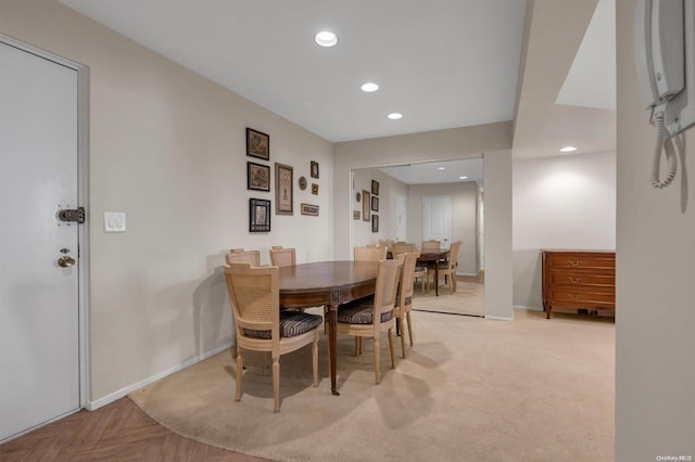 dining area with light parquet flooring