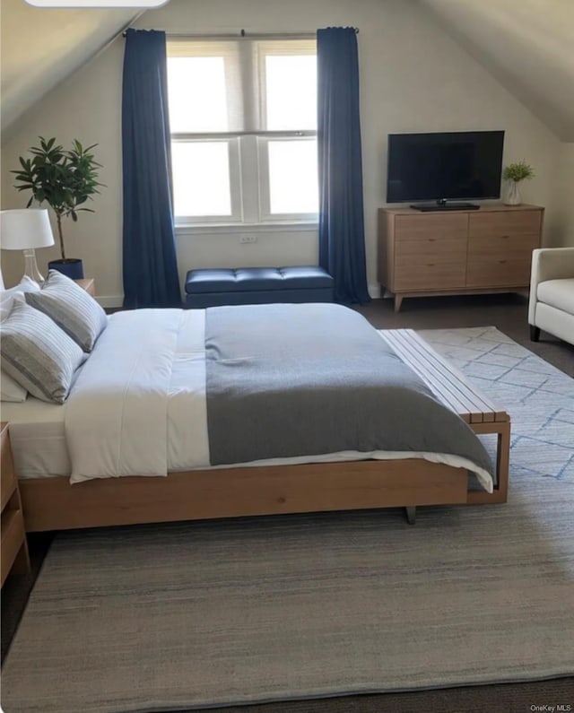 bedroom with lofted ceiling