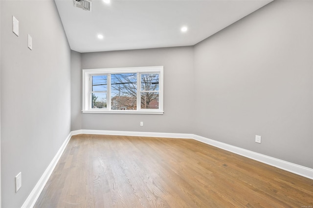 unfurnished room with light hardwood / wood-style flooring