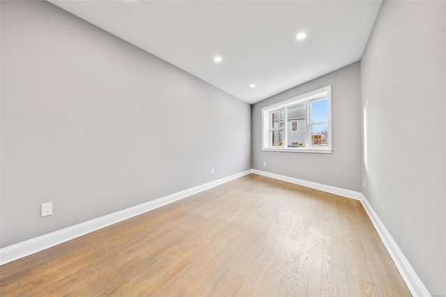 empty room with light hardwood / wood-style floors