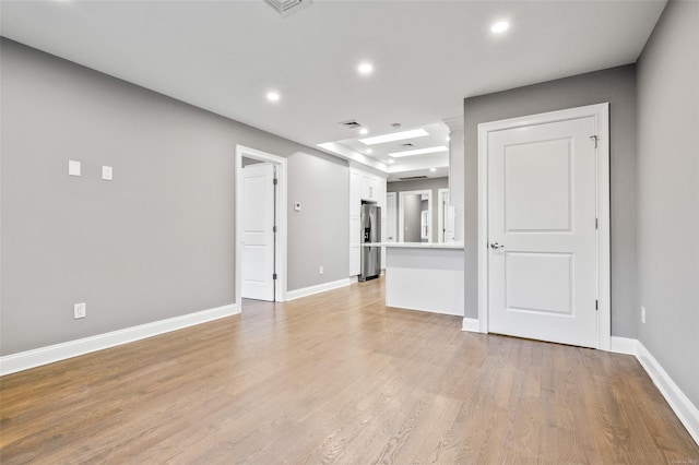 unfurnished living room with light wood-type flooring