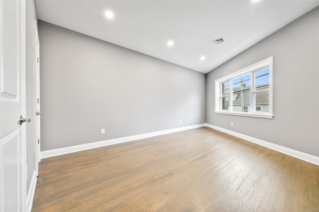 unfurnished room featuring hardwood / wood-style floors