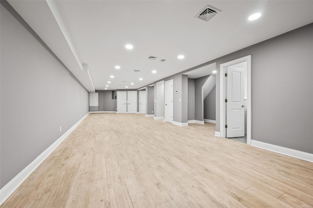 basement featuring light wood-type flooring