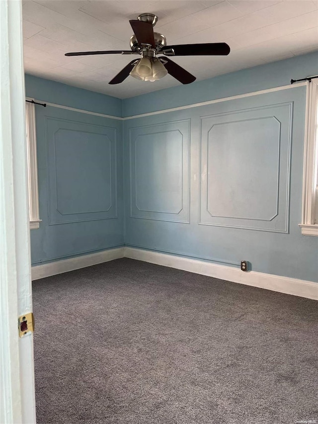 unfurnished room featuring carpet and ceiling fan