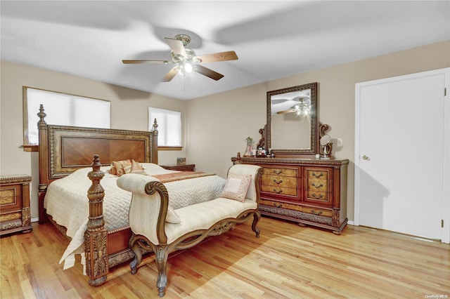 bedroom with ceiling fan and light hardwood / wood-style floors