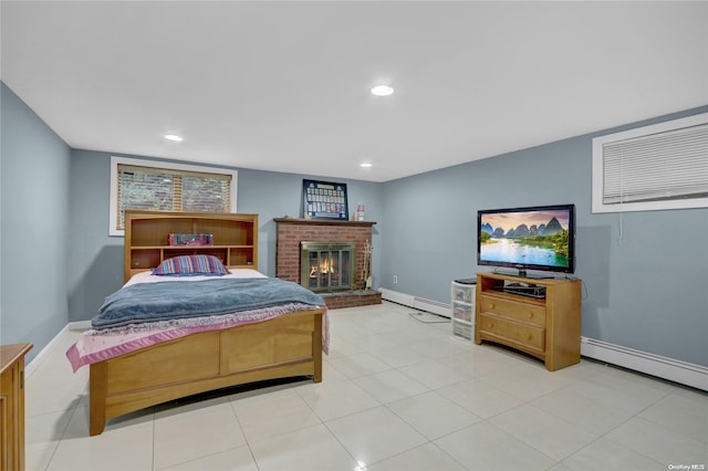 bedroom featuring a fireplace and a baseboard heating unit