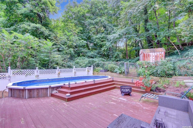 view of pool featuring a wooden deck