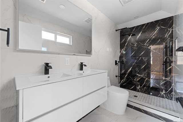 bathroom featuring vanity, toilet, tiled shower, and tile walls