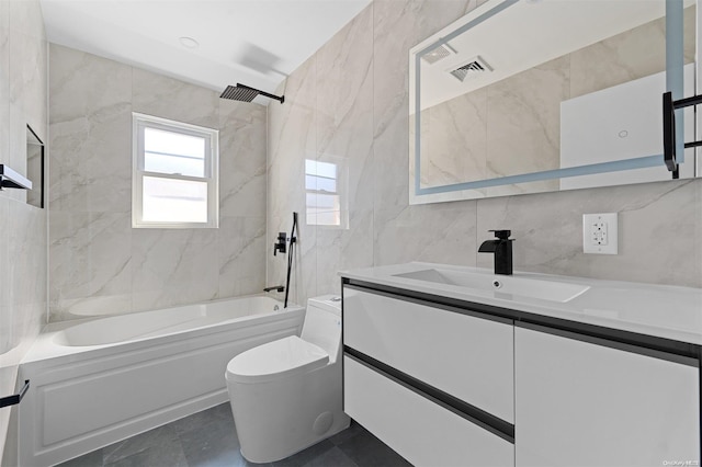 full bathroom featuring toilet, vanity, tile walls, and tiled shower / bath