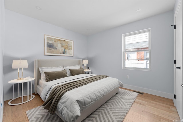 bedroom with light hardwood / wood-style floors