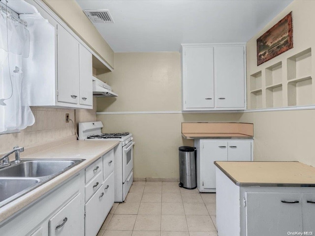 kitchen with sink, white cabinets, white range, and ventilation hood